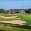 A view of a green and the clubhouse at Prestwick Village Golf Club