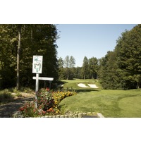 The first hole on the Threetops golf course at Treetops Resort is a 143-yard par 3 to a perched green.